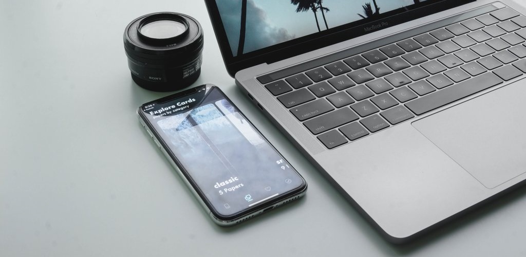 MacBook and smartphone on a desktop