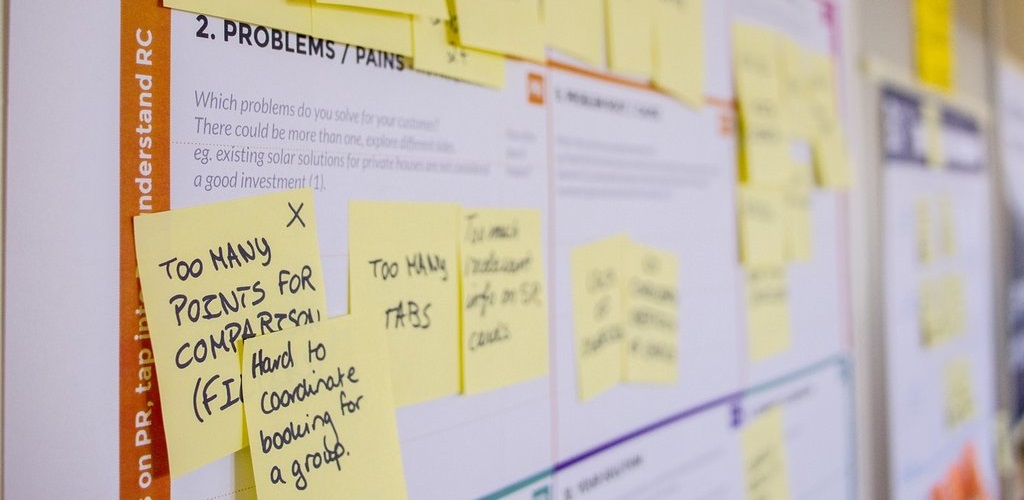 Problems and pains Post-Its on a wall