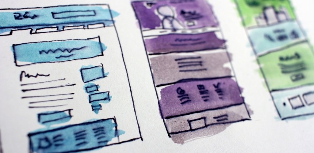 Three website design sketches with different layouts. One is blue, one is purple, one is green.